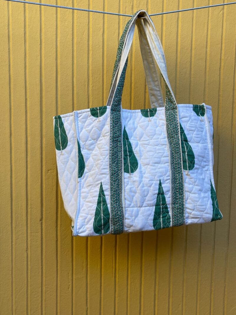 Bolsa de tela acolchada pinos